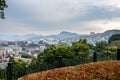 Nagasaki landscape view with autumn trees and overcast sky seen from Glover Garden on the hill overlooking the city, Japan.