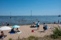 Nagele, Flevoland, The Netherlands - Families at the Ketel beach with the blue lake in the background