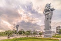 Sunrise on the  giant stone dragon head of the pillars that greet cruise ship visitors close to the Naha Port Cruise Terminal dock Royalty Free Stock Photo