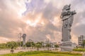 Sunrise on the giant stone dragon head of the pillars that greet cruise ship visitors close to the Naha Port Cruise Terminal dock