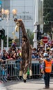 Participant of the annual carnival of Adloyada walking on stilts, dressed in a giraffe costume in Nahariyya, Israel