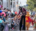 Participants of the annual carnival of Adloyada walking on stilts, dressed in fabulous costumes in Nahariyya, Israel Royalty Free Stock Photo