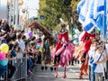 Participants of the annual carnival of Adloyada walking on stilts, dressed in fabulous costumes in Nahariyya, Israel Royalty Free Stock Photo