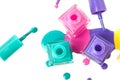 Group of three colorful nail polish bottles on spilled paint Royalty Free Stock Photo