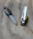 Nail clipper and emery file on wooden board Royalty Free Stock Photo