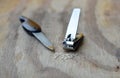 Nail clipper and emery file on wooden board Royalty Free Stock Photo