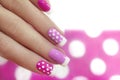 Nail design with white dots.