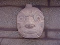 A Nail head (Cabeza Clava) or zoomorphic face carved in stone from the pre-incan culture Chavin in Ancash Region, Peru Royalty Free Stock Photo