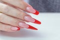 Nail Polish. Art Manicure. Modern style red black gradient Nail Polish. Beauty hands with Stylish Colorful trendy Nails w Royalty Free Stock Photo