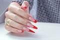 Nail Polish. Art Manicure. Modern style red black gradient Nail Polish. Beauty hands with Stylish Colorful trendy Nails w Royalty Free Stock Photo