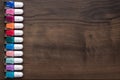 Nail polish bottles on brown wooden table