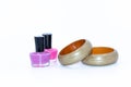 Nail polish bottles and green wooden bangles Royalty Free Stock Photo