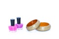 Nail polish bottles and wooden bangles Royalty Free Stock Photo