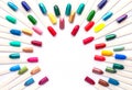 Nail polish colorful samples in rainbow colors. Set of artificial nails. Top view, copy space for text