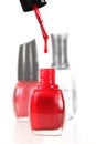 Nail Polish Dripping Into a Bottle of Red Enamel Royalty Free Stock Photo