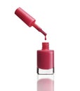 Nail polish dripping from brush into bottle Royalty Free Stock Photo