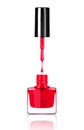 Nail polish dripping from brush into bottle on white Royalty Free Stock Photo