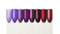 Nail polish samples isolated on white, colorful nail tips in violet, lilac, purple, red, nail salon advertising