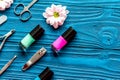 Nail polish and spa manicure set on dark wooden background Royalty Free Stock Photo