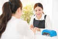 Nail salon worker giving a manicure