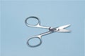 nail scissors isolated on blue background
