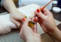 Nail technician makes nail extensions gel in the beauty salon