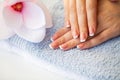 Nails care. Beautiful woman`s nails with french manicure, in beauty studio