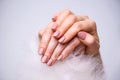 Nails Design. Hands With Bright Pink Spring Manicure On Grey Background. Close Up Of Female Hands. Art Nail