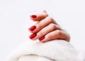 Nails Design. Hands With Bright Red Spring Manicure On Grey Background. Close Up Of Female Hands. Art Nail