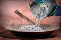 Nails from a Galvanized Bucket Being Poured Out