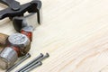 Nails, hammer and nipper on wooden background