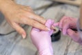 Nails manicure detail with file or brush item. Woman beautiful nail care process