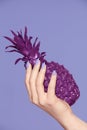 Nails Manicure. Hand With Stylish Nails Holding Purple Pineapple