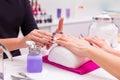 Nails saloon woman nail polish remove with tissue