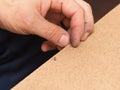 Nails, screws, hammer on a wooden background Royalty Free Stock Photo