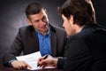 Naive man signing the usury contract Royalty Free Stock Photo