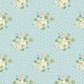 Naive seamless pattern with green and white abstract floral ornament. Blue background with dots