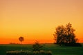 A beautiful fiery red sunset over a golf course. Royalty Free Stock Photo