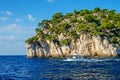 A tour boat sails along the rocks of the National Parc des Calanques. Royalty Free Stock Photo