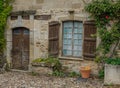 Stone facade with wooden door and window