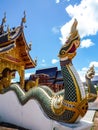 Naka statue on staircase balustrade at Thai Buddhist pagoda