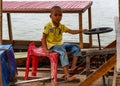 Child driving a Boat Laos Royalty Free Stock Photo