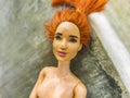 Naked dirty Barbie doll toy outside on the floor Mexico Royalty Free Stock Photo