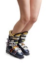 Naked female legs in ski boots