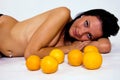 Naked girl and oranges Royalty Free Stock Photo