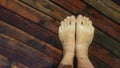 Naked hairy male legs walk on pier. The legs of a man swim. First person of view. Men rest on a flood wood underwater Royalty Free Stock Photo