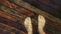 Naked hairy male legs walk on pier. The legs of a man swim. First person of view. Men rest on a flood wood underwater Royalty Free Stock Photo