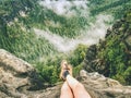 Naked legs of successful hiker on exposed sandstone rock