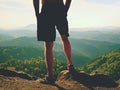 Naked man stay in black pants at the top of mountain. Hiker watch the morning hilly landscape Royalty Free Stock Photo