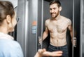 Young couple trying new shower cabin in the shop Royalty Free Stock Photo